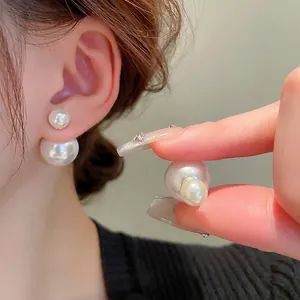 Minimalist double-sided pearl stud earrings with silver needles for a classic elegant look