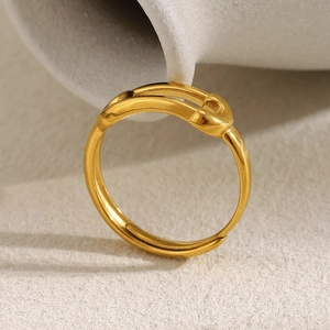 Macro shot of double-layered 18K gold-plated stainless steel ring with knot detail