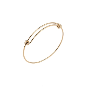 Detail view of 1.8mm adjustable gold stainless steel wire bangle with sliding knots