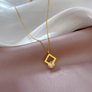 Minimalist square zircon titanium steel necklace on soft pink and white silk background