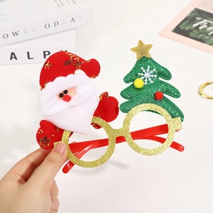 Christmas party glasses with Santa Claus and sparkling tree decorations for festive holidays