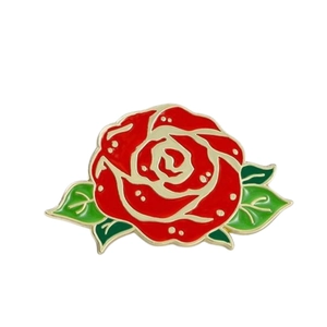 Elegant red rose enamel pin with green leaves and gold plating on white background