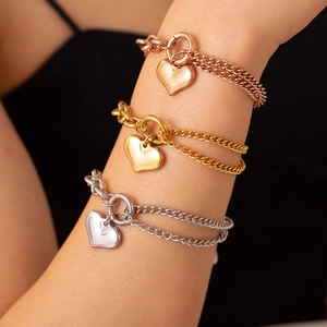 Double-layered stainless steel heart bracelet in rose gold, gold, and silver finishes
