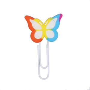 Rainbow butterfly bookmark with colorful silicone top and white metal paperclip on white backdrop