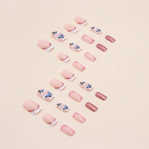 Pink glitter press-on nails with blue butterfly patterns and French tips in square shape