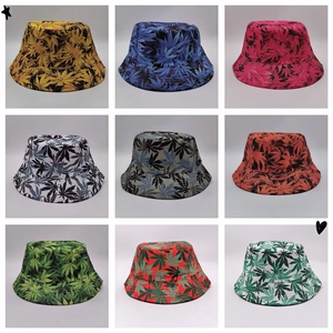 Detailed overview showing nine colorful reversible bucket hats with all-over leaf prints