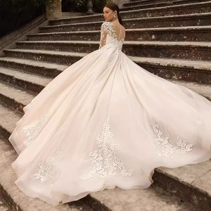 Elegant lace bridal gown with a luxury long train and delicate floral embroidery