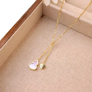 18k gold plated stainless steel necklace featuring a pink shell gourd and heart pendant