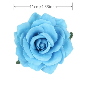 Macro detail of sky blue fabric rose hair clip showing 11cm diameter size guide