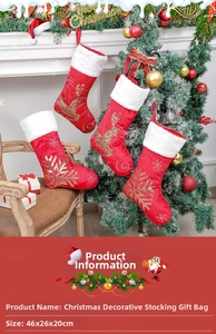 Close-up of red velvet Christmas stocking with gold sequin reindeer embroidery and dimensions