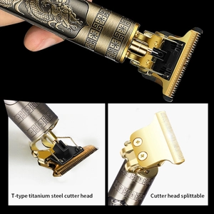Professional metal hair clipper with T-blade and dragon relief design in a 3-grid view