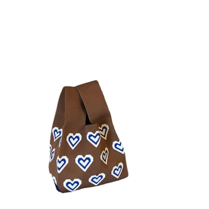 Brown knitted tote bag featuring blue and white heart patterns for a cute women's style