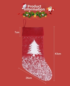 Detail view of red knitted Christmas stocking with white tree pattern and 43cm size dimensions