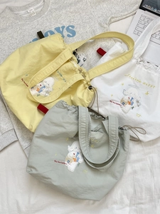 Minimalist canvas drawstring tote bag with cute sheep embroidery in yellow, white and green