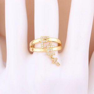 Golden double-layer pin ring with FE letters, cross pendant and micro-set zircons