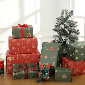 Close-up of festive Christmas ribbons and gift boxes with gold elk and snowflake patterns