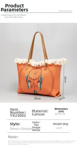 Detailed view of orange canvas tote with fringe trim and colorful dreamcatcher design