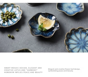 Macro detail of ceramic petal snack dish with blue kiln mutation glaze and rustic brown edges