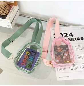 Detailed view of pink and green transparent PVC crossbody bags with gold hardware