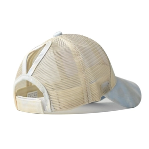 Detail of tie-dye ponytail sun hat with breathable mesh and adjustable velcro strap