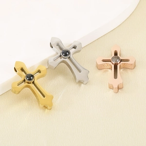 Minimalist stainless steel cross pendants in gold, silver, and rose gold finishes