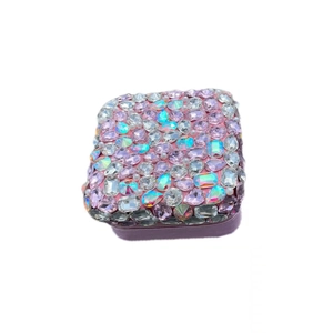 Detail of a luxury pink jewelry box with a sparkling rhinestone-encrusted square lid