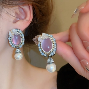 Vintage palace style earrings with purple crystal, resin bow, and pearl pendant for women