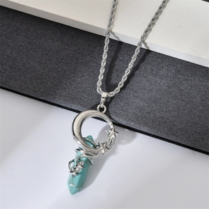 Detail of silver moon and star wire-wrapped hexagonal turquoise crystal pendant necklace