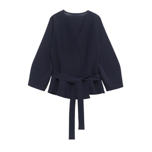 Navy wrap knit top with V-neck, shoulder pads, and waist belt for a modern chic look