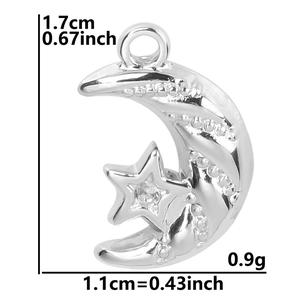 Detailed view of polished silver crescent moon and star pendant with crystal accent