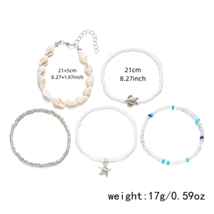 Detail view of 5-piece anklet set with shell and starfish charms including size specs