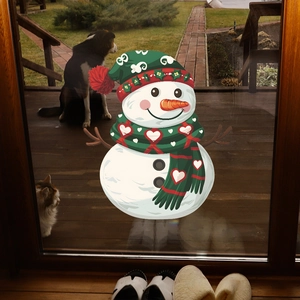 Christmas snowman window decals on glass door with festive winter decorations for home