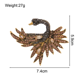 Vintage black swan brooch with heavy rhinestones and crystal tassels in gold finish