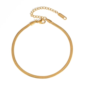 Macro detail of gold stainless steel snake chain anklet with lobster clasp and extension