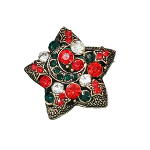 Star-shaped Christmas brooch with crescent moon, red rhinestones and antique gold finish