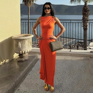 Elegant bright orange sleeveless maxi dress with golden metal hardware and ruched detail