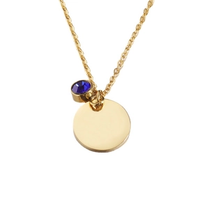 Polished gold stainless steel necklace with round disc pendant and blue birthstone jewel