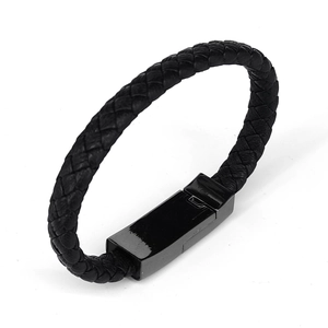 Minimalist black braided leather charger bracelet with metallic magnetic clasp on white backdrop