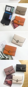 Detail of short tri-fold wallet showing card slots, transparent ID window and litchi texture