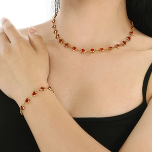Golden stainless steel necklace and bracelet set with sweet red glass heart charms