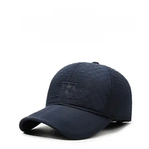 Detail of dark blue winter baseball cap featuring quilted thick fabric and 3D embroidery