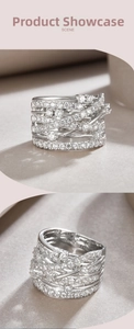 Macro view of wide multi-layer crisscross silver ring with pavé moissanite stones