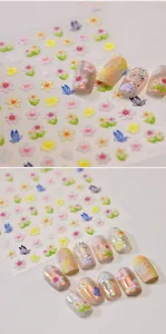 Macro view of 3D embossed floral and butterfly nail stickers with detailed relief
