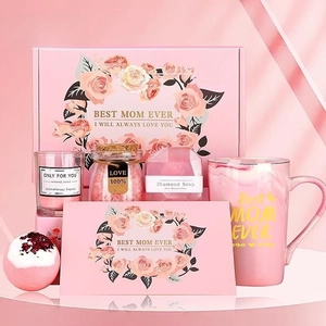 Pink Mother's Day gift set with Best Mom Ever mug, scented candle, and bath spa products