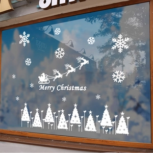 White Christmas window stickers featuring Santa Claus, sleigh, reindeer and snowflakes