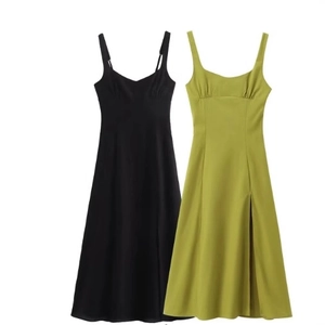 Women's chic black and green side slit slip dresses shown in a front flat lay view