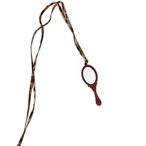 Vintage folk style necklace with leopard print lanyard and red embossed mirror pendant