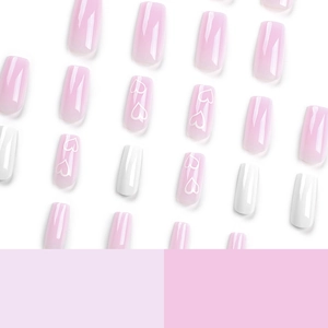 Pink and white heart pattern press-on nails in medium square shape set for Valentine's Day