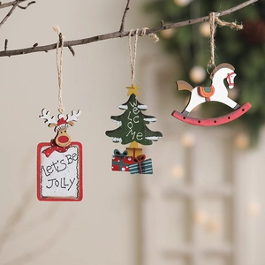 Handcrafted wooden Christmas ornaments featuring reindeer and tree hanging on a branch
