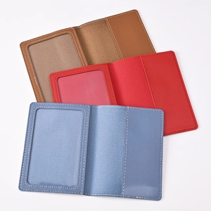 Detail view of foldable PU leather passport covers in brown red and blue with card slots